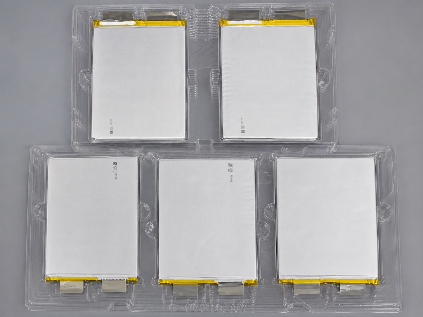 Five real lithium pouch cells in production trays